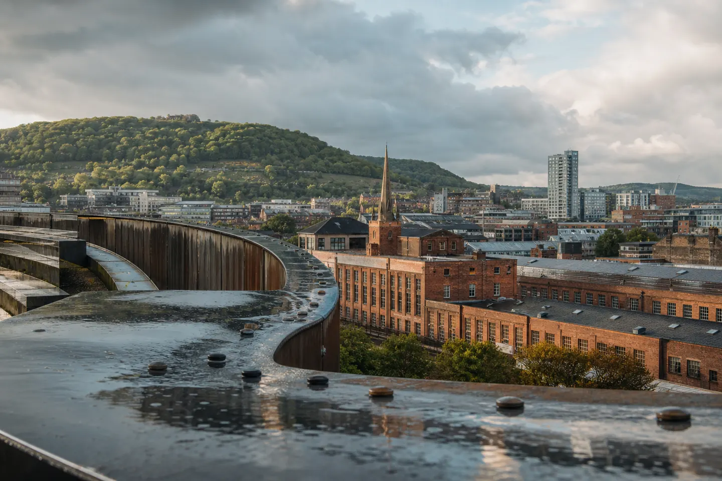 Sheffield industrial architecture and green hills representing the businesses Josh supports with SEO